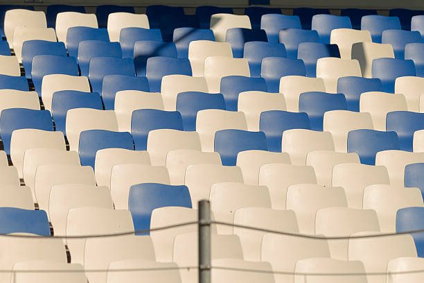 istock There are numerous rows of blue and white seats situated in a stadium 2224690802