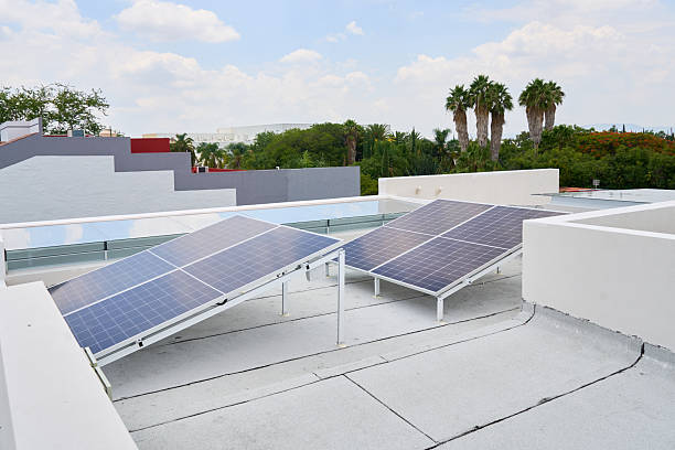 istock Modern house with solar panels on the roof 2224691941