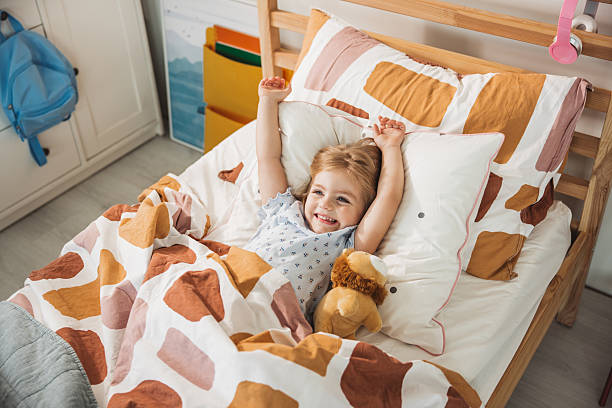 istock Adorable little girl waking up 2224693631
