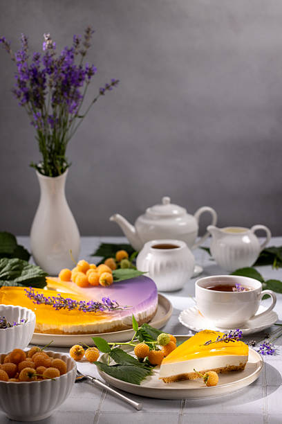 Delicious lavender and yellow raspberry cheesecake with a cup of tea