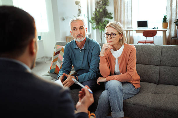 istock Mature couple having consultation with agent at home 2224698092