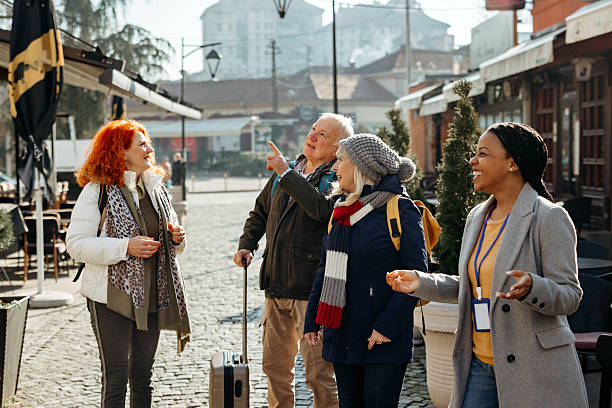 istock Senior friends on guided city tour 2224698102