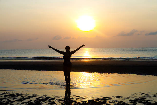 istock Sunrise and silhouette traveler 2224699320