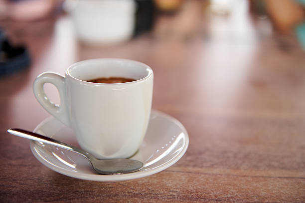 istock Close-Up View of a Fresh Espresso Coffee on a Wooden Table Setting 2224699714