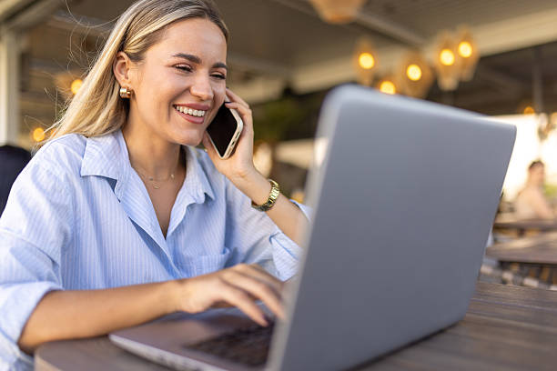 istock Beautiful woman working from cafe 2224699959