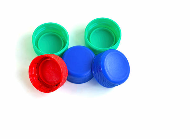 istock Plastic bottle caps isolated on white background, concept of environmental protection, littering of environment. 2224705250