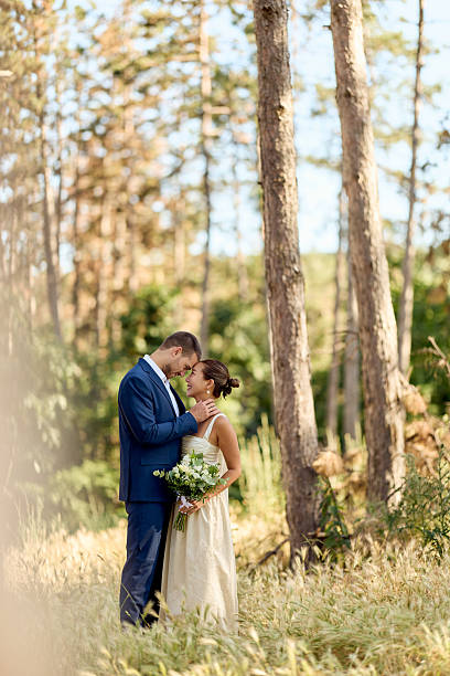 istock Romantic Wedding Couple Embracing in a Serene Woodland Setting 2224705286