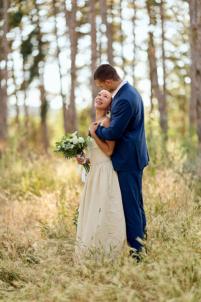 istock Romantic Couple's Wedding Day Photoshoot in a Scenic Forest Clearing 2224705288