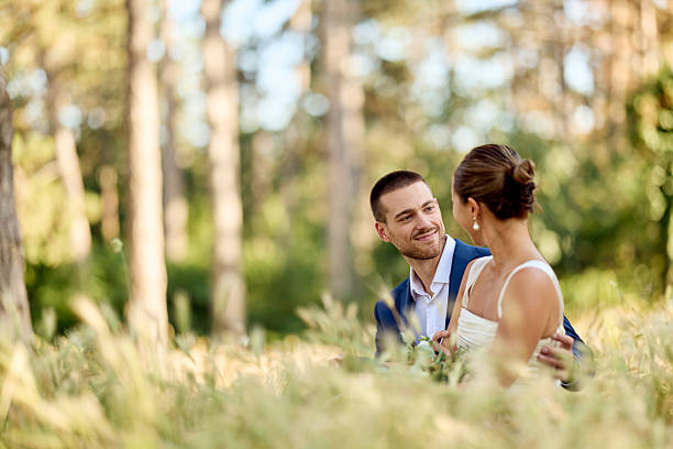 istock Romantic Couple Outdoors in Forest Setting With Love and Affectionate Smiles 2224705295