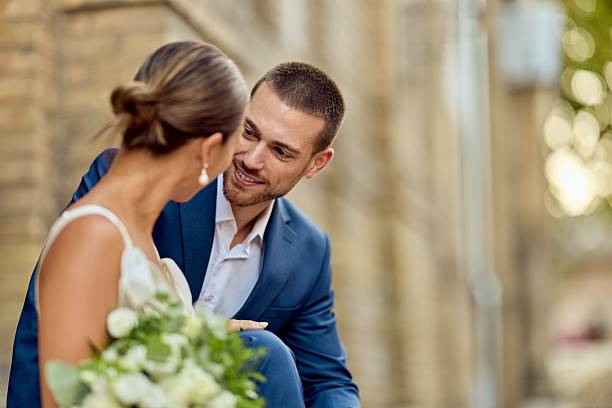 istock Bride and Groom Sharing Moment in Outdoor Setting on Wedding Day 2224705325