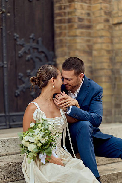 istock Romantic Couple Sharing Tender Moment on Wedding Day with Bouquet 2224705326