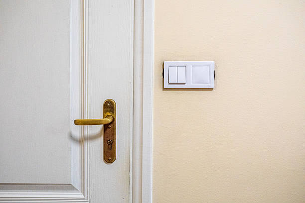istock white switch on the wall where cosmetic repairs are needed 2224707371