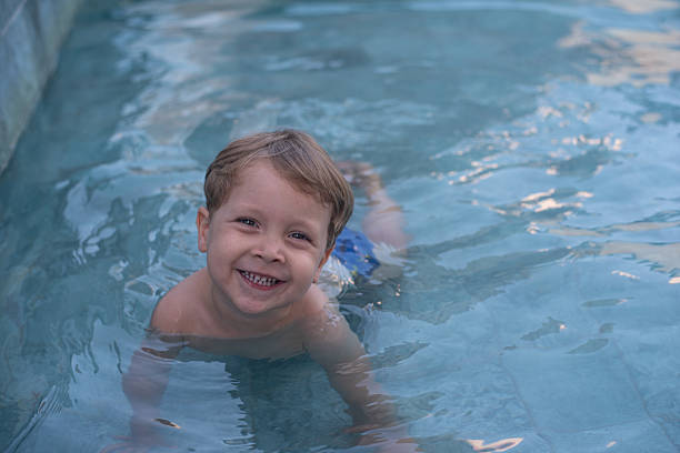 istock Kid smiling in a children's pool 2224709090