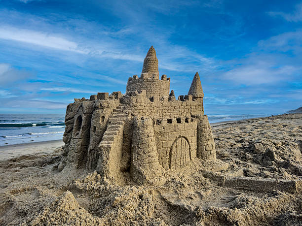 istock Large Sandcastle on the Beach Under a Bright Sunny Sky 2224712485