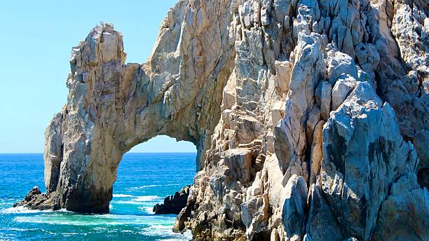 istock A rock formation with a arch over the water 2224715196