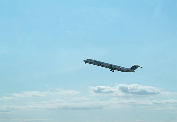 Seattle, Washington, United States - August 16, 2006: Alaska Airline Plane Climbing In Blue Sky With White Clouds