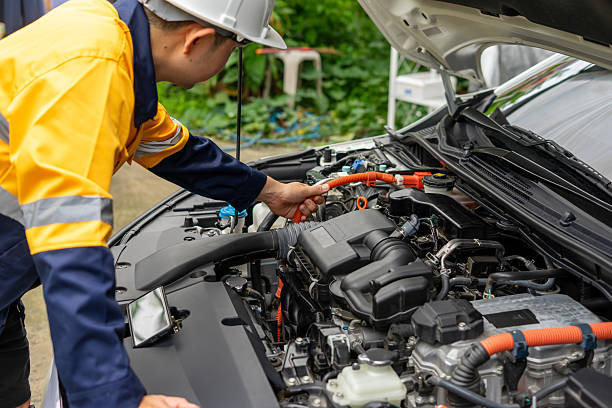 istock Mechanic inspecting car engine with focus and precision 2224721375