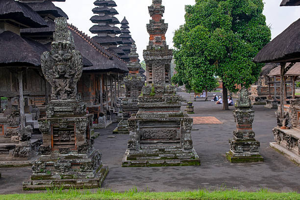 Local Visitors pray at Pura Taman Ayun in Bali. It is a water temple built in 1634 in Bali’s western village of Mengwi. This temple is UNESCO recognized for its culture and history.