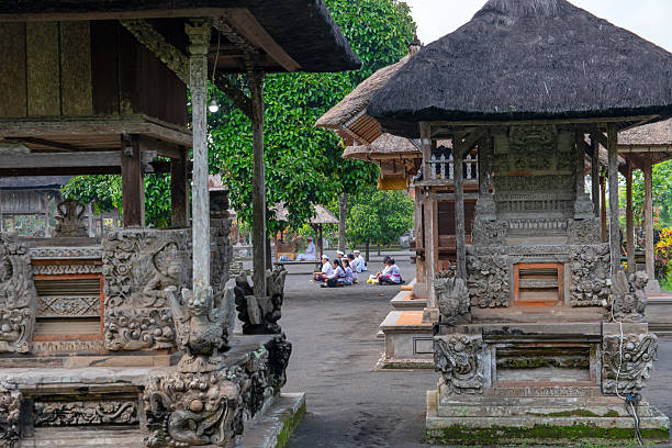Local Visitors pray at Pura Taman Ayun in Bali. It is a water temple built in 1634 in Bali’s western village of Mengwi. This temple is UNESCO recognized for its culture and history.