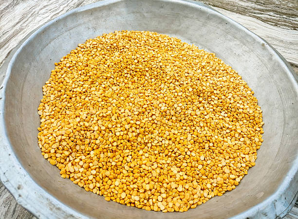 The photo showcases the texture and golden-yellow color of the lentils, commonly used in Indian cooking.