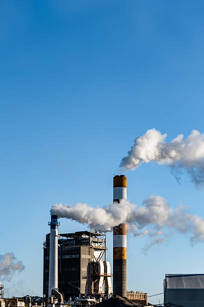 istock smoke rising from a factory chimney, 2224723819