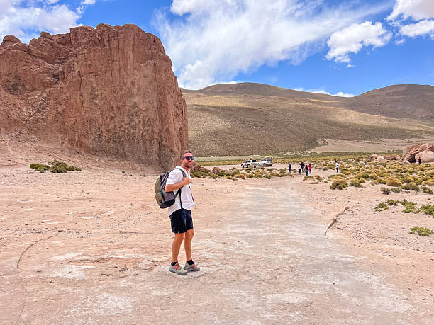 istock Male Hiker Exploring Rocky Desert Landscape 2224727381