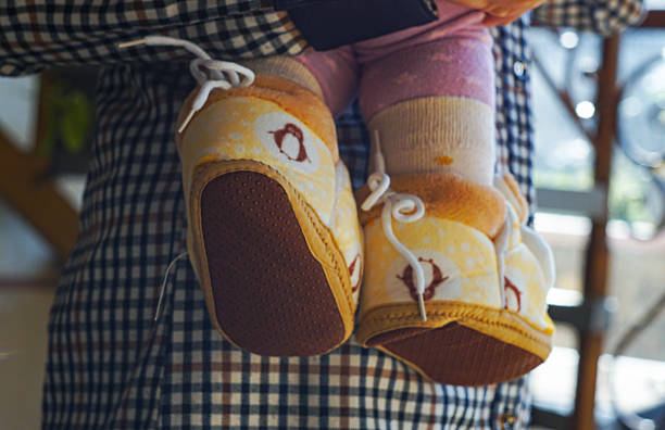 Knitted baby elephant booties - white background