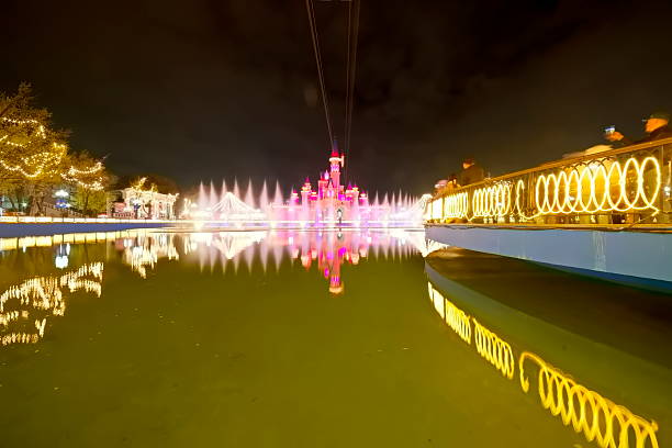 Magic City Park, Tashkent, Uzbekistan – March 27, 2025, A fairytale castle & a fantasy town with colorful houses, cafes & entertainment, at a theme park at night