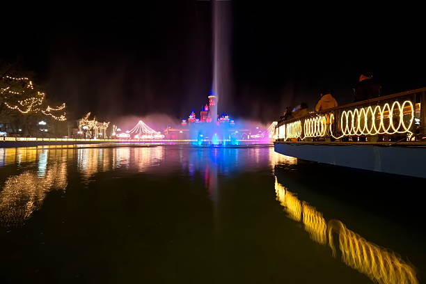 Magic City Park, Tashkent, Uzbekistan – March 27, 2025, A fairytale castle & a fantasy town with colorful houses, cafes & entertainment, at a theme park at night