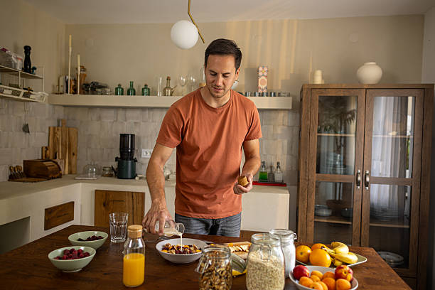 istock Man preparing healthy breakfast at home 2224744144