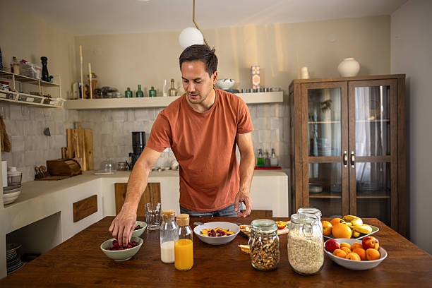 istock Man preparing healthy breakfast at home 2224744232
