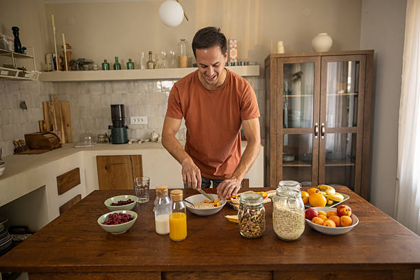 istock Man preparing healthy breakfast at home 2224744434