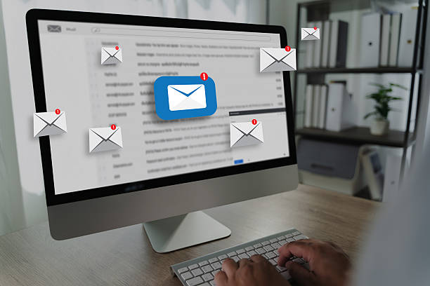 istock man reading e-mail on smartphone email inbox and email with laptop on internet information from spam mail 2224745243