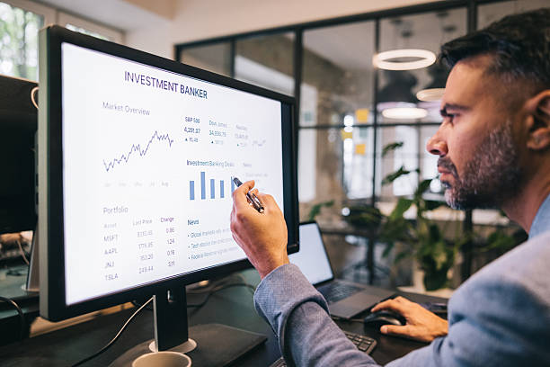 istock Professional Investment Banker Analyzing Financial Data in a Modern Office Environment 2224746794