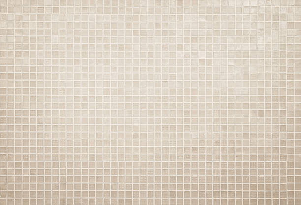 istock Cream light ceramic wall and floor tiles mosaic background in bathroom and kitchen. Design pattern geometric with grid wallpaper texture decoration pool. Simple seamless abstract surface clean. 2224747401