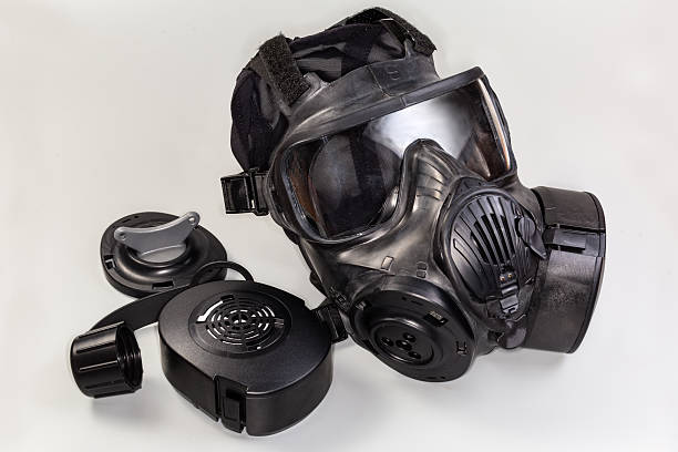 istock Rubber gas mask and several its accessories on gray background 2224751928