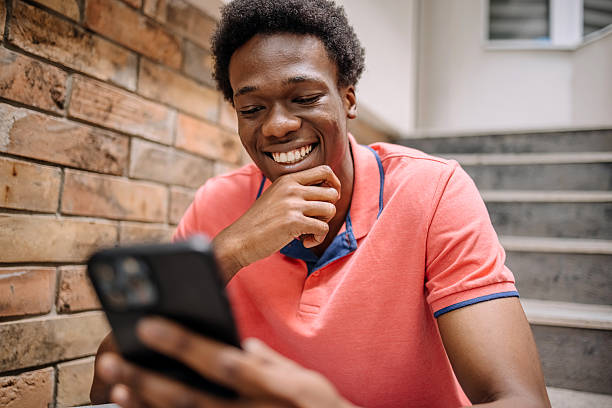 istock People feeling happiness while sitting and looking at mobile phone 2224752830