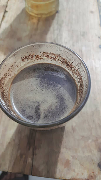 istock Rustic Close-Up of Coffee Cup with Dark Beverage on Wooden Surface 2224758177