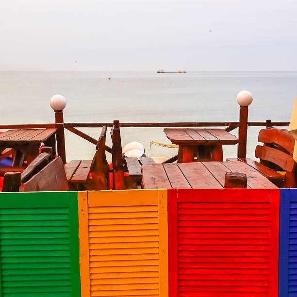 Beach outdoor caf? with a bright multi-colored wooden fence.