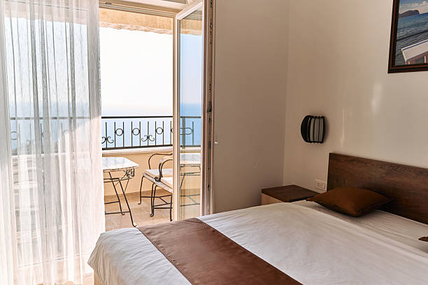 istock Serene ocean view from modern room with balcony and elegant decor | peaceful retreat 2224769456
