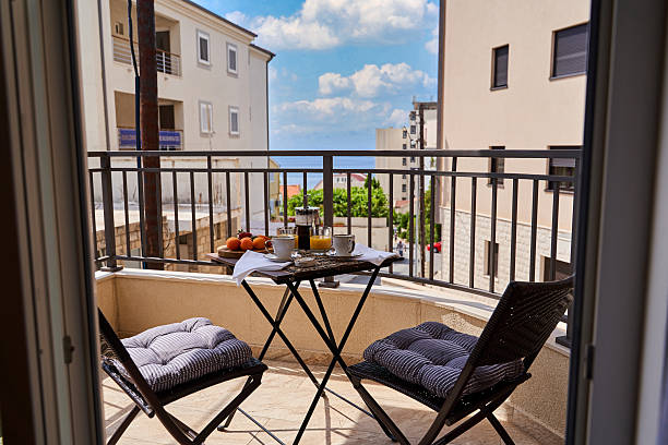 istock Cozy balcony breakfast with ocean view and comfortable seating on a sunny morning 2224773481