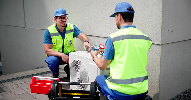 istock Skilled HVAC Technician Meticulously Inspects Commercial Air Conditioner 2224774581