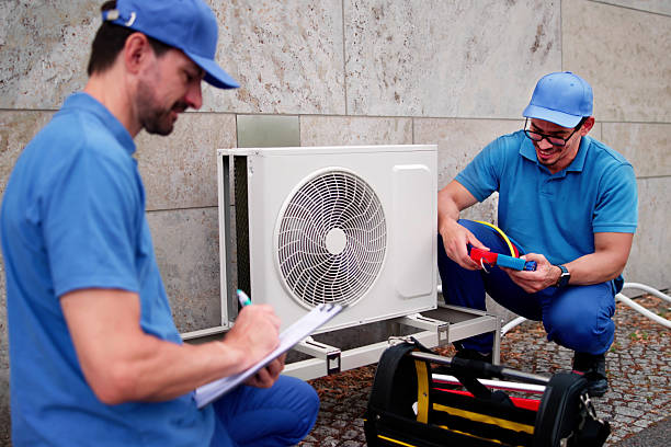 istock Skilled HVAC Technician Installs New Commercial Air Conditioning 2224774620