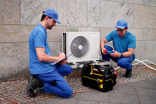istock Experienced Hispanic HVAC Technician Installing Commercial Air Conditioning 2224774639