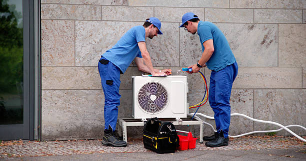 istock Hispanic Male HVAC Technician Inspecting Commercial Air Conditioning Unit 2224774642