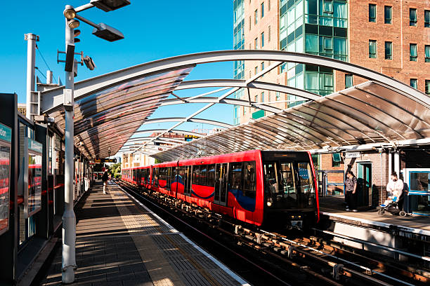 istock Docklands light railway train arriving at a station in london 2224776396