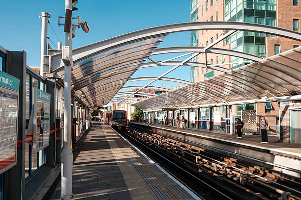 istock Train arriving at london overground station in a sunny day 2224776421