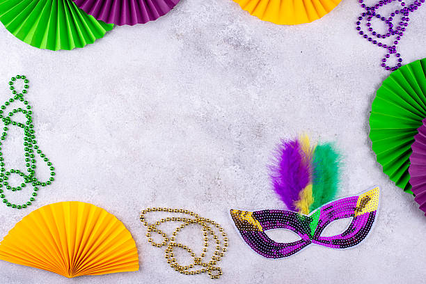 istock Vibrant Mardi Gras background with mask, beads, and festive decorations 2224780301