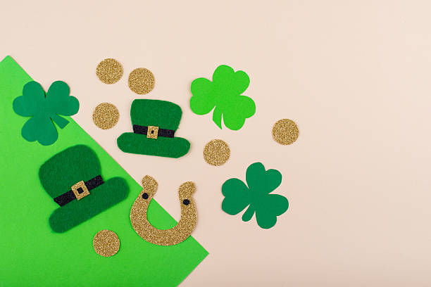 istock St. Patrick's Day concept with leprechaun hat, gold coins and horseshoe 2224781327