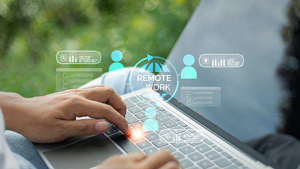 istock Close-up of hands typing on a laptop with remote work and virtual team icons, representing flexible work, online collaboration, and digital communication in modern business. 2224783387